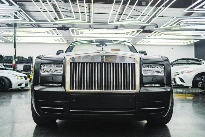 a black and white rolls royce parked in a garage, renaissance, in 2 0 1 5, square, getty images proshot, facing front