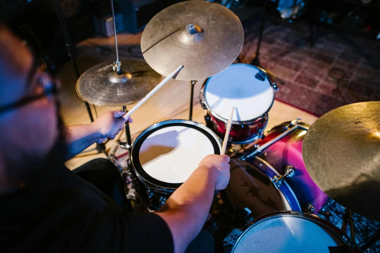 a man playing drums in a recording studio, an album cover, by Joe Bowler, shutterstock, 15081959 21121991 01012000 4k, lachlan bailey, middle close up, indoor setting