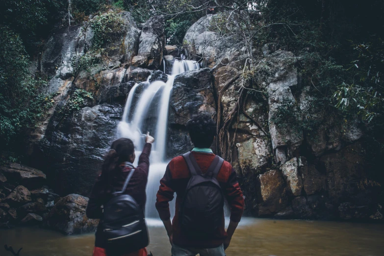 two people standing in front of a waterfall, pexels contest winner, facing away from camera, malaysia jungle, avatar image, profile picture