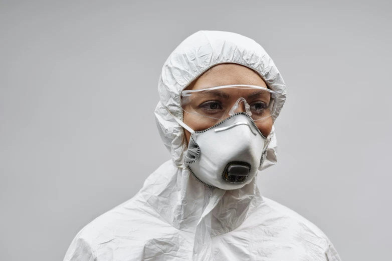 a man wearing a protective suit and goggles, by Adam Marczyński, plasticien, grey, woman, individual, basic