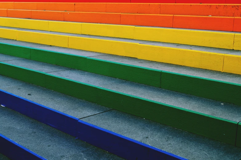 a person riding a skateboard down a flight of stairs, inspired by Okuda Gensō, unsplash, color field, square lines, benches, lgbt flag, industrial colours