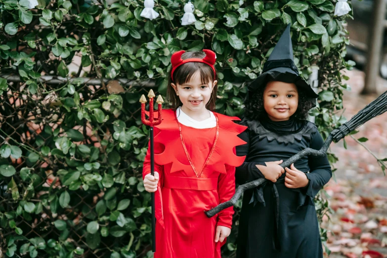 two young children dressed up in halloween costumes, pexels contest winner, international gothic, scarlet witch, magical garden plant creatures, avatar image