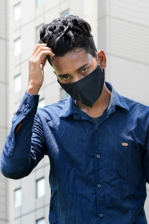 a man in a blue shirt and a black mask, modelling, south east asian with round face, wearing a black shirt, head to toe