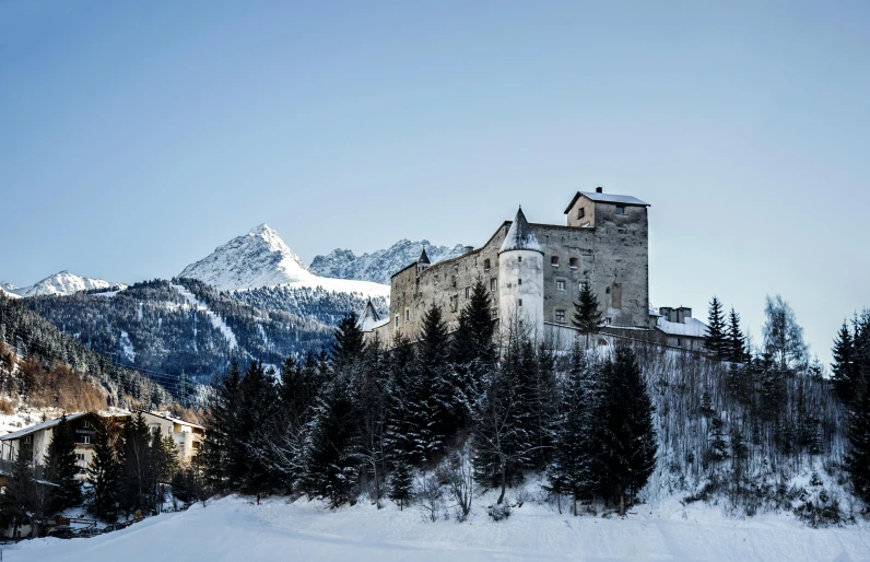 a castle sitting on top of a snow covered hill, alpes, fan favorite, exterior, rustic