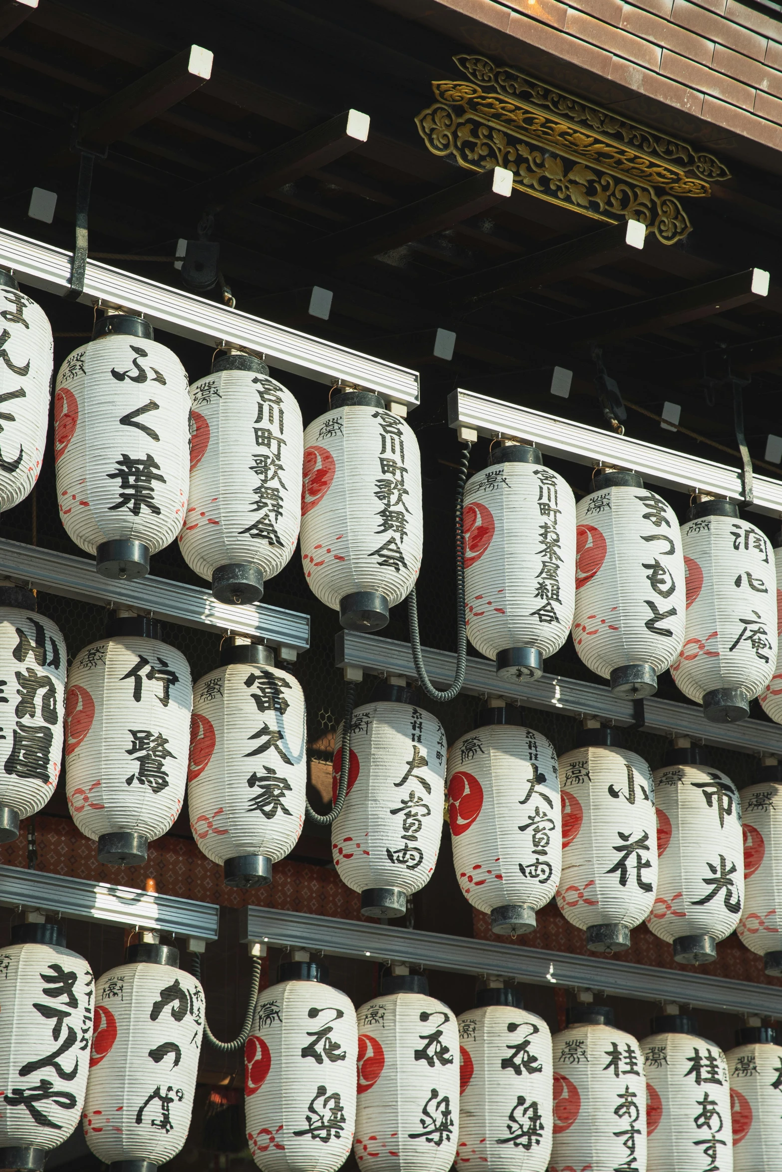 a wall filled with lots of white and red paper lanterns, a picture, inspired by Sesshū Tōyō, sōsaku hanga, with white kanji insignias, teaser, as photograph, back