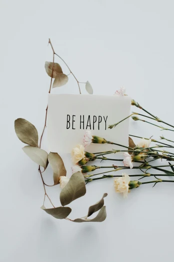 a bouquet of flowers and a card that says be happy, by Dulah Marie Evans, trending on unsplash, eucalyptus, paul barson, studio photo, multiple stories
