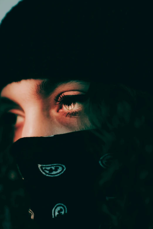 a close up of a person wearing a bandana, inspired by Elsa Bleda, trending on pexels, visual art, dark visor covering eyes, eyes projected onto visor, looking at you, photograph of a techwear woman