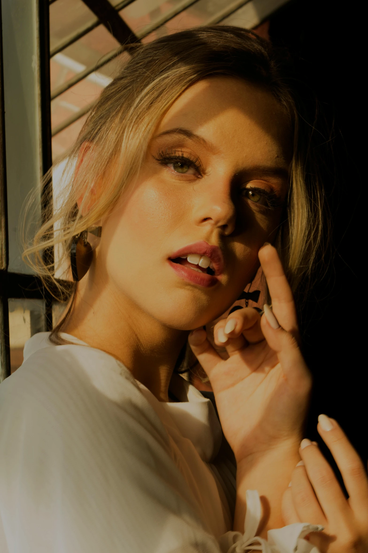 a woman talking on a cell phone next to a window, digital art, inspired by Elsa Bleda, trending on pexels, photorealism, portrait anya taylor-joy, jewelry, soft shadow, close up of a blonde woman