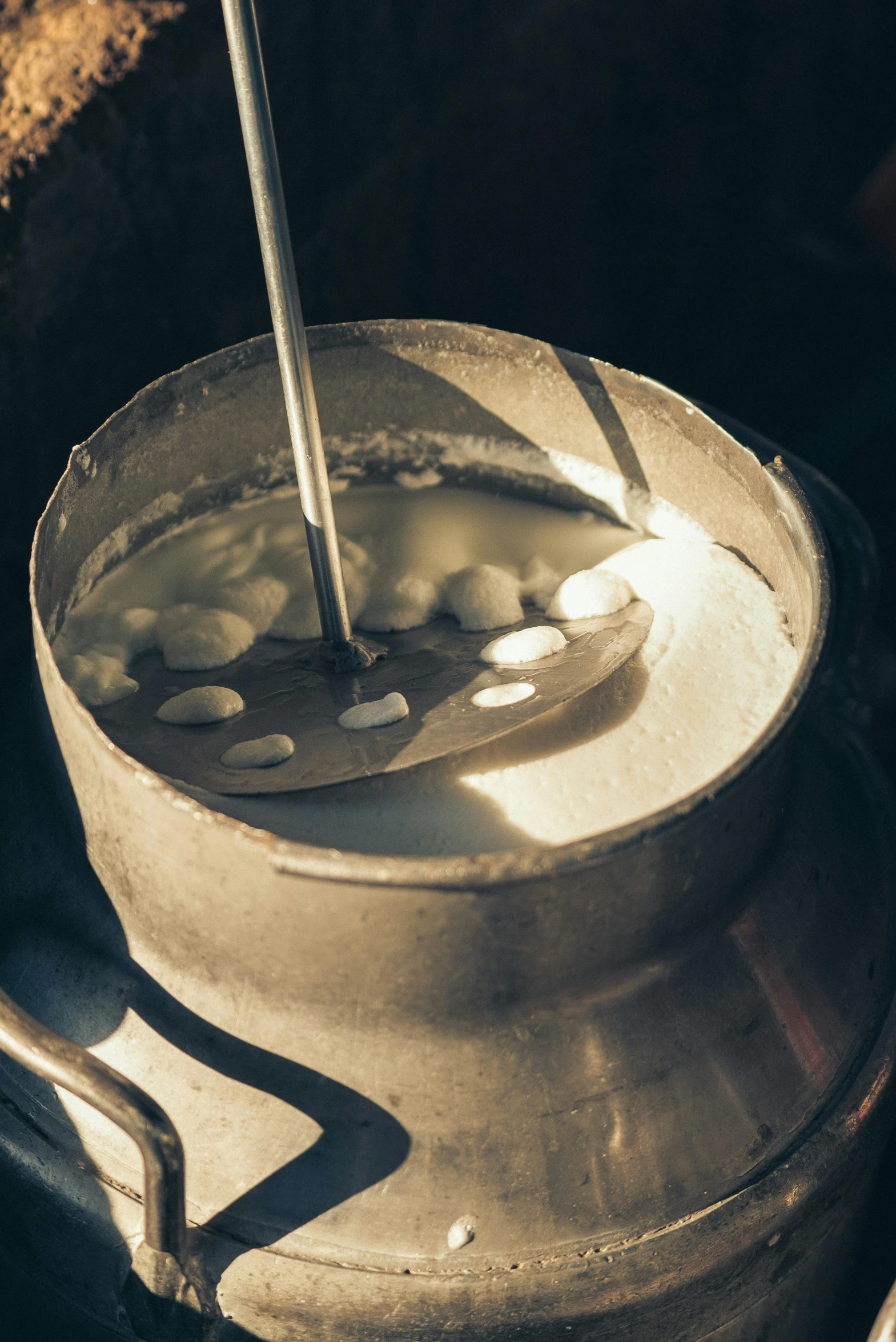 a large metal pot sitting on top of a stove, milk dripping, thumbnail, cotton, patagonian