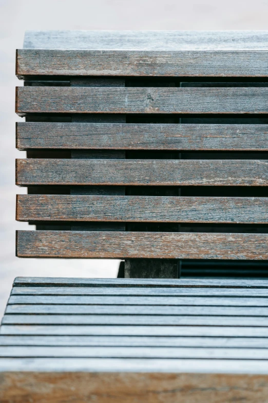 a wooden bench sitting next to a body of water, an album cover, inspired by Peter Zumthor, unsplash, postminimalism, detailed metal textures, detail structure, blue metal, iron cladding