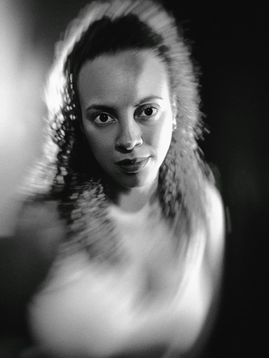 a black and white photo of a woman, a black and white photo, by Dimitre Manassiev Mehandjiysky, art photography, cinematic. by leng jun, motionb blur, anna nikonova aka newmilky, tessa thompson inspired