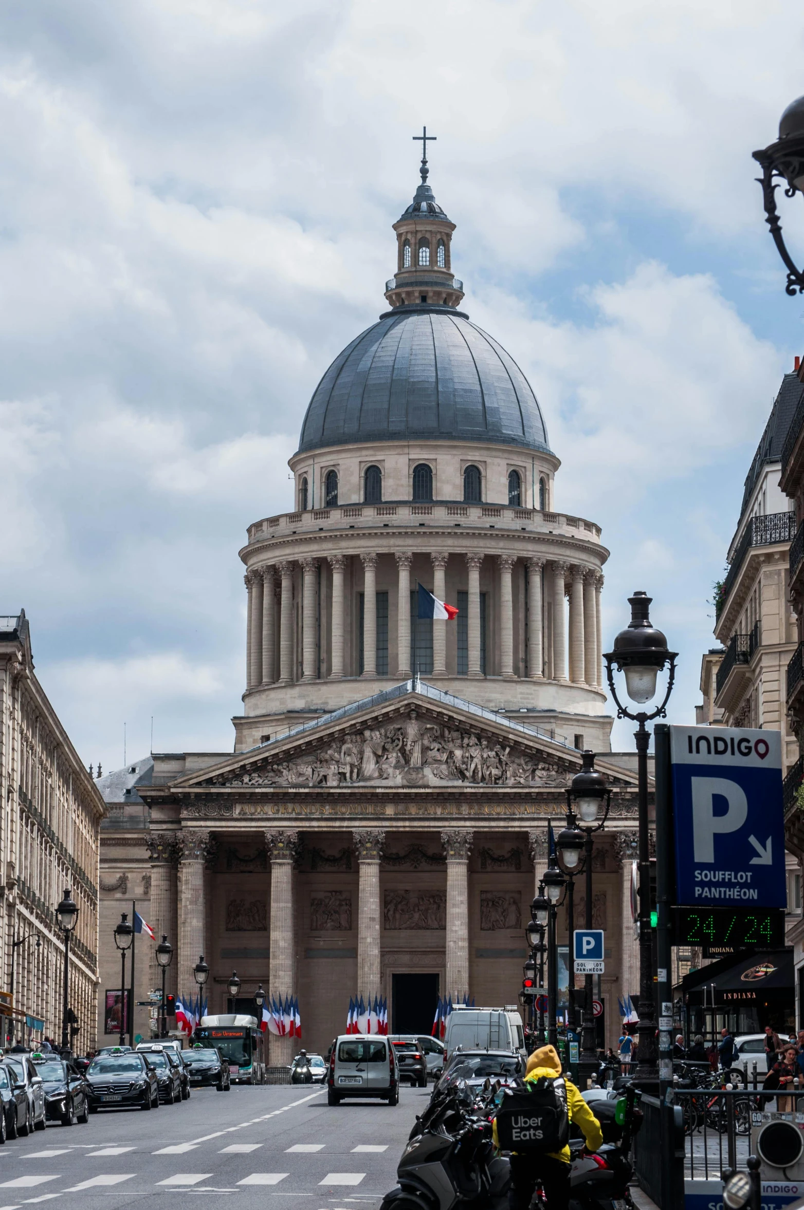 a street filled with lots of traffic next to tall buildings, a photo, paris school, pantheon, profile image