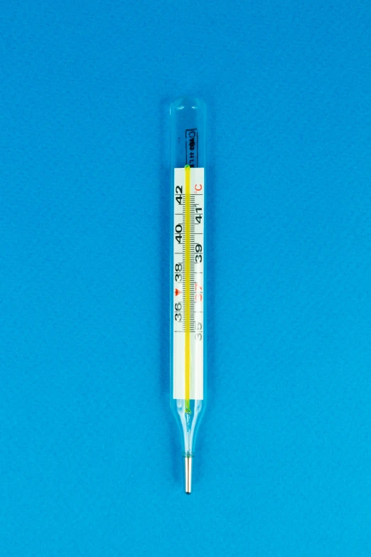 a thermometer sitting on top of a blue surface, iv pole, yellow, listing image, scientific glassware