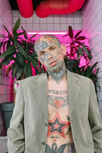 a man with a lot of tattoos on his body, an album cover, by Jessie Alexandra Dick, wearing a worn out suit, taken in 2022, slide show, clear sharp todd solondz face