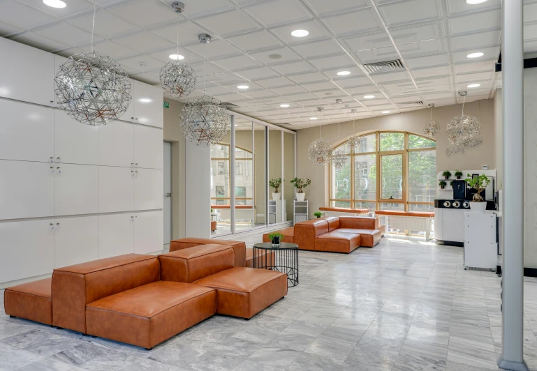 a living room filled with furniture and lots of windows, inspired by Albert Paris Gütersloh, unsplash, light and space, in legnica city hall, suspended ceiling, health spa and meditation center, neo kyiv