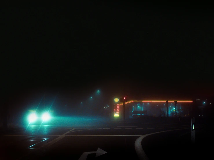 a couple of cars driving down a street at night, by Filip Hodas, conceptual art, “gas station photography, cyan fog, dark, led