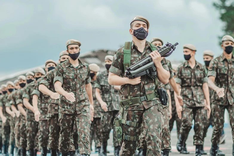 a group of soldiers marching down a street, a colorized photo, by Adam Marczyński, shutterstock, jair bolsonaro, wearing camo, avatar image, singapore
