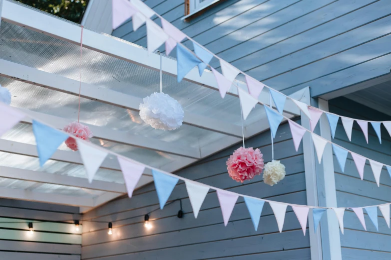 a patio covered in white and pink tissue pom poms, a cartoon, by Helen Stevenson, unsplash, light blue and white tones, close up shot from the side, red pennants, summer lighting