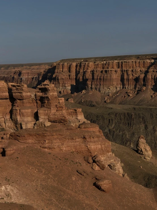 a man standing on top of a cliff next to a canyon, by Simon Gaon, slide show, gigapixel photo