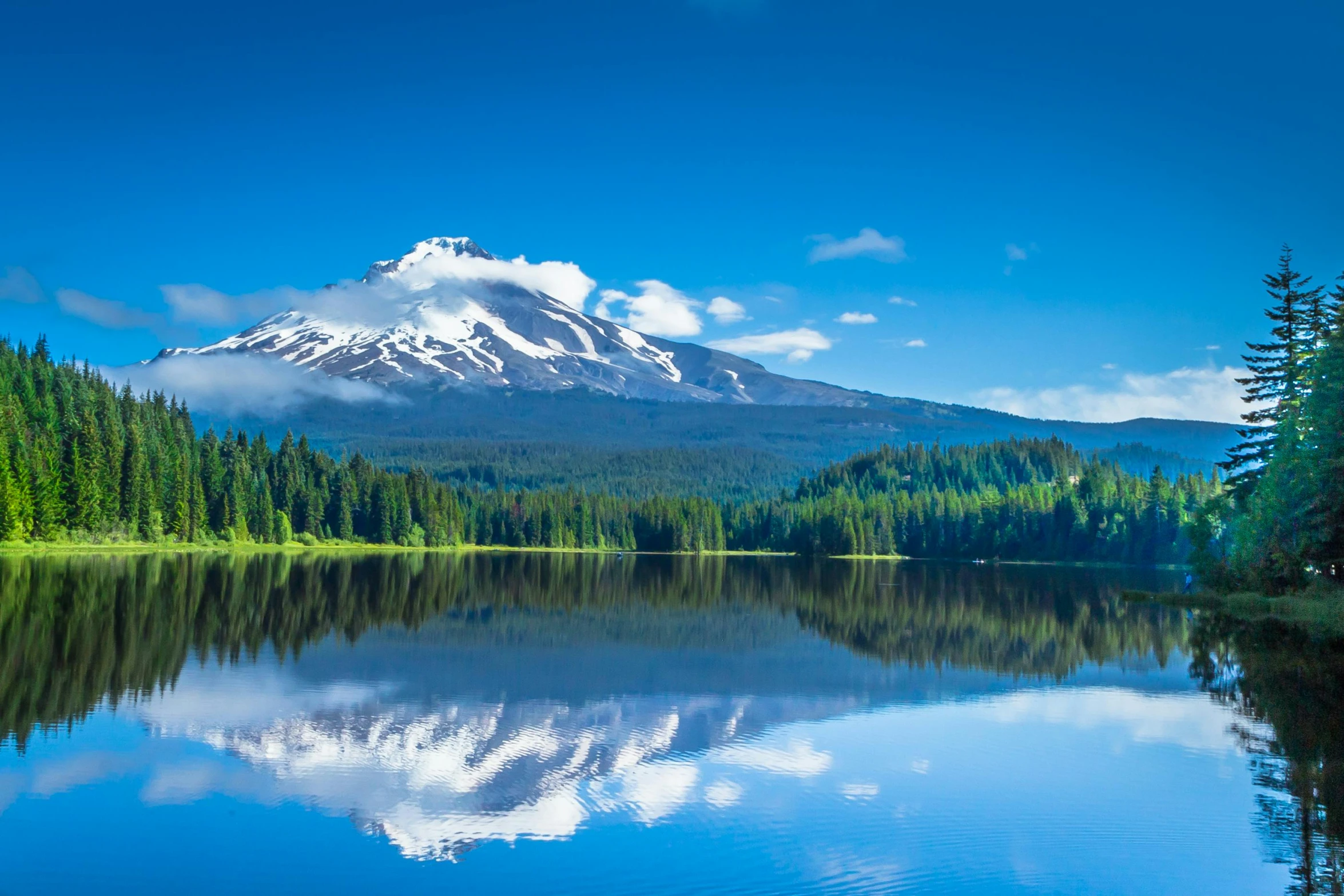 a lake with a mountain in the background, a photo, by Meredith Dillman, shutterstock, portland oregon, fan favorite, with snow on its peak, avatar image