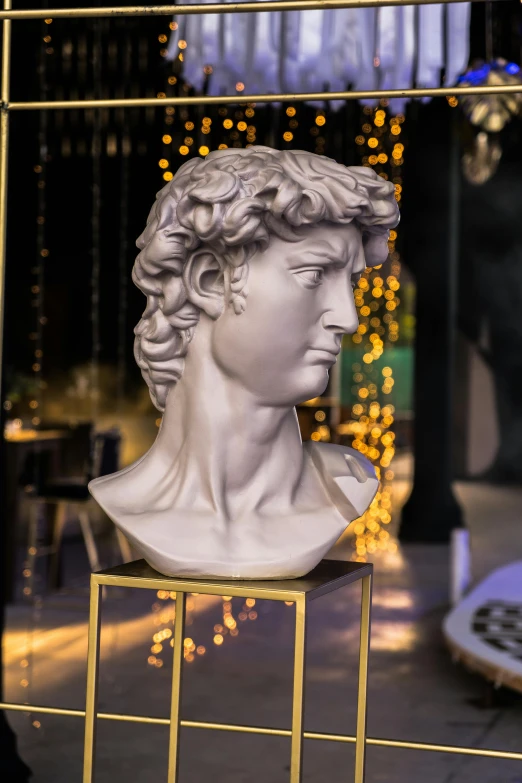 a bust of a man sitting on top of a table, a marble sculpture, inspired by Andrea del Verrocchio, trending on pexels, detailed glowing head, ready to eat, fashionable, portrait of mark zuckerberg