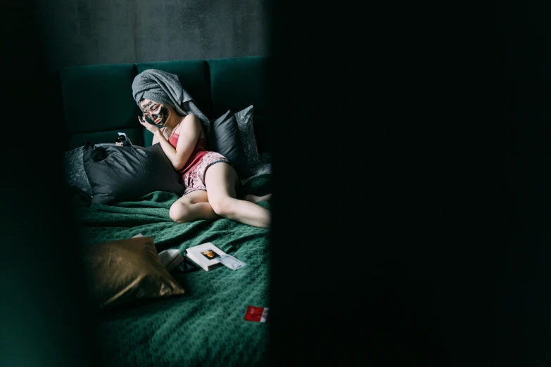 a woman laying on a bed talking on a cell phone, a picture, inspired by Elsa Bleda, pexels contest winner, cyberpunk childrens bedroom, shot with hasselblad, 15081959 21121991 01012000 4k, akali