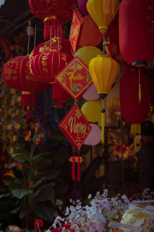 a bunch of red and yellow lanterns hanging from a ceiling, vietnamese temple scene, paul barson, square, medium - shot