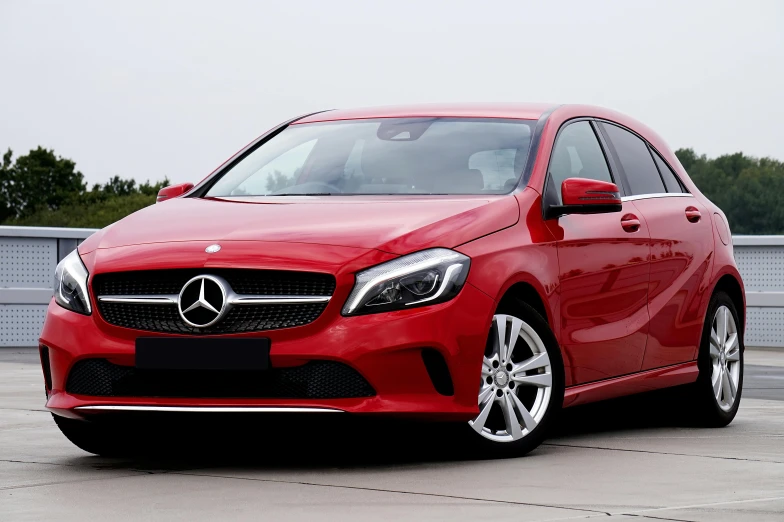 a red mercedes cla parked in a parking lot, pexels, square, a car, halogen, full car