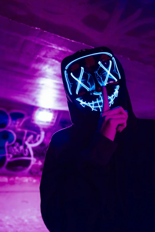 a person in a hoodie with a neon mask on, pexels contest winner, lightshow, instagram post, demon black blue purple, neon wiring