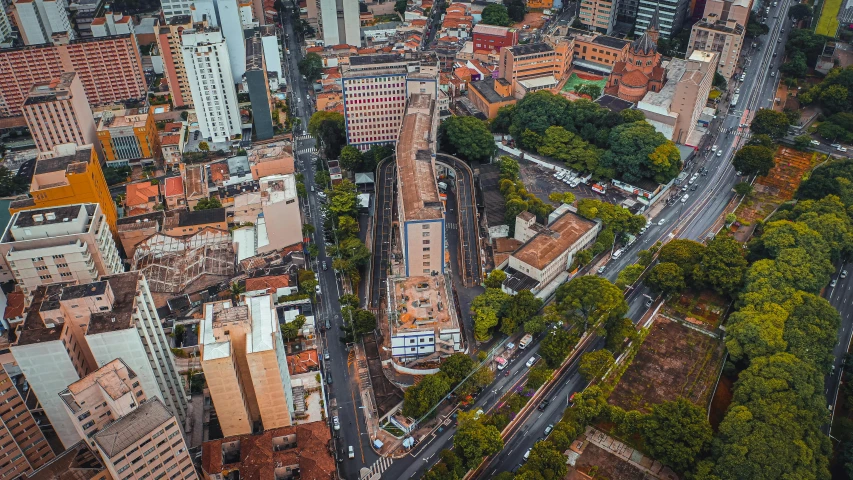 a city filled with lots of tall buildings, a photo, by Luis Miranda, pexels contest winner, graffiti, aerial view of an ancient land, orange line, brazilian, hospital