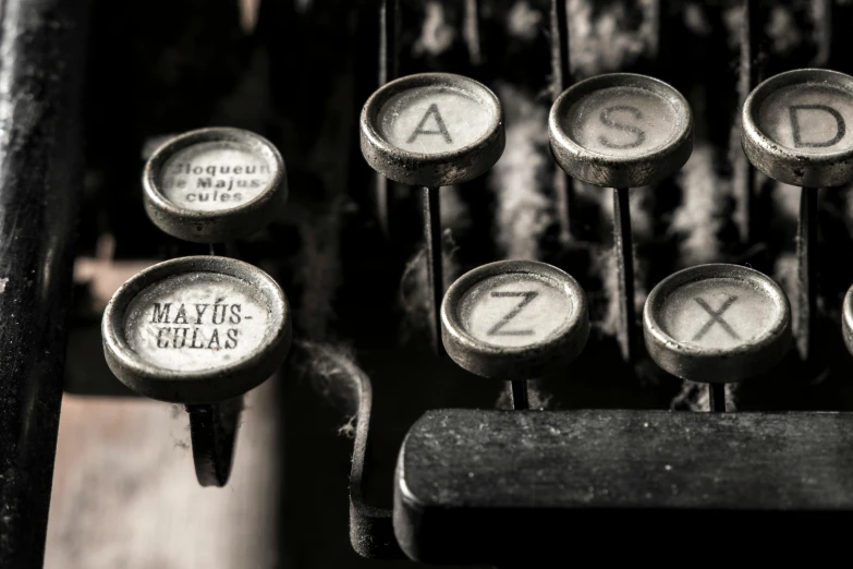 a close up of the keys of an old typewriter, a black and white photo, by Lucia Peka, pexels contest winner, private press, colour photograph, panel, magda torres gurza, advertising photograph