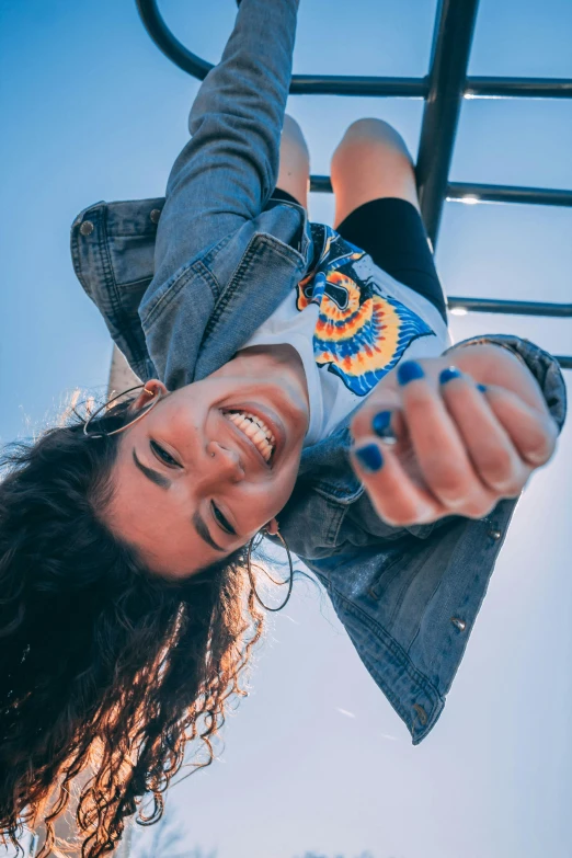 a close up of a person on a monkey bars, pexels contest winner, smiling down from above, blue sky, teen girl, avatar image