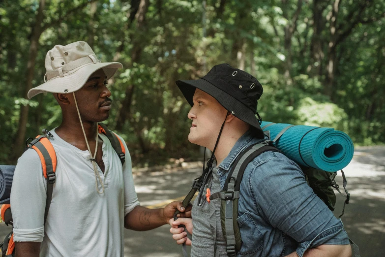 a couple of men standing next to each other, pexels contest winner, alexis franklin, trecking, varying ethnicities, white male