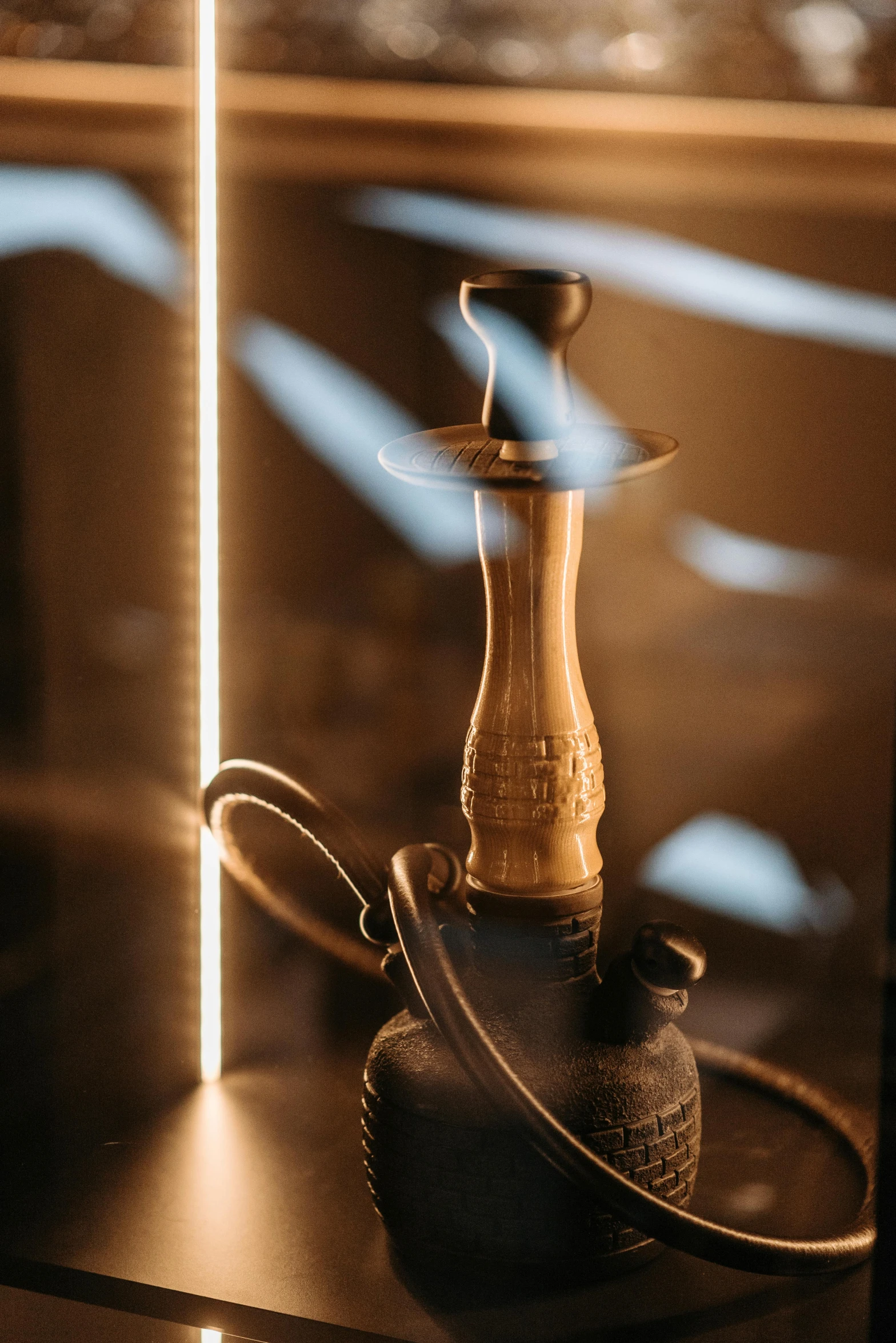 a glass case with a hook on top of it, a still life, trending on unsplash, hurufiyya, a hookah smoking caterpillar, back lit lighting, detailed product image, clubs