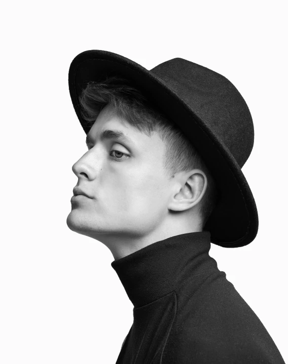 a black and white photo of a man wearing a hat, inspired by Josef Abel, non binary model, profile pic, soccer player martin ødegaard, alternate album cover