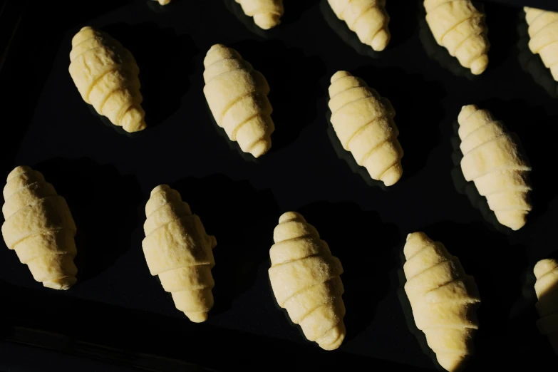 a pan filled with doughnuts sitting on top of a table, isopod, carved ivory, high quality product image”, various sizes