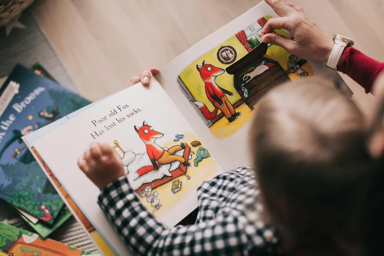 a child sitting on the floor reading a book, a storybook illustration, by Julia Pishtar, pexels, playing with a fox, richard scarry, printed page, close up portrait shot