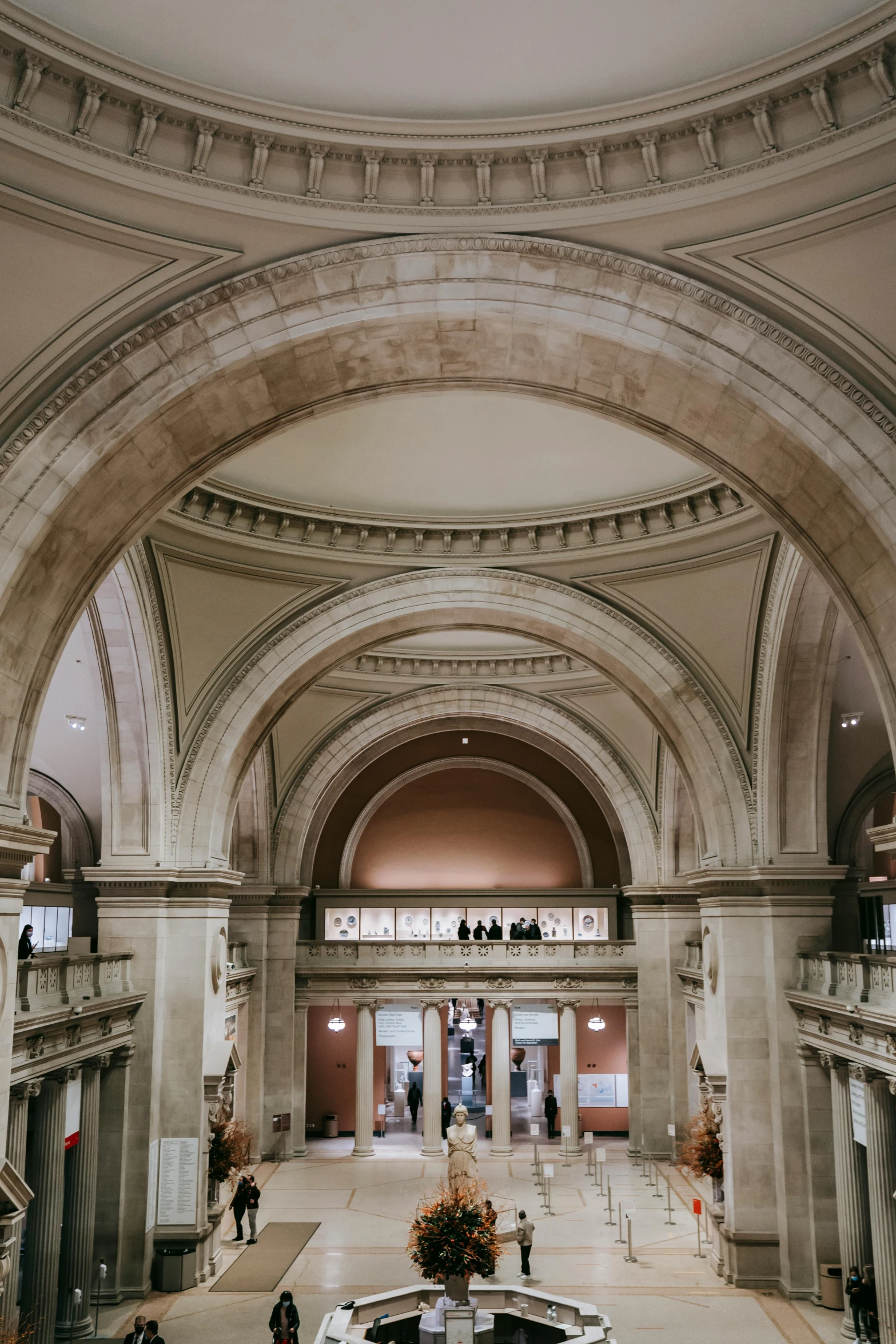 a large building with a fountain inside of it, by Nina Hamnett, trending on unsplash, art nouveau, high arched ceiling, metropolitan museum photo, 2 5 6 x 2 5 6 pixels, entrance