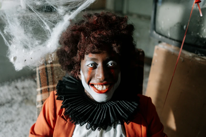 a close up of a person wearing a clown costume, pexels contest winner, lowbrow, dark-skinned, sitting down, trick or treat, portrait of rung