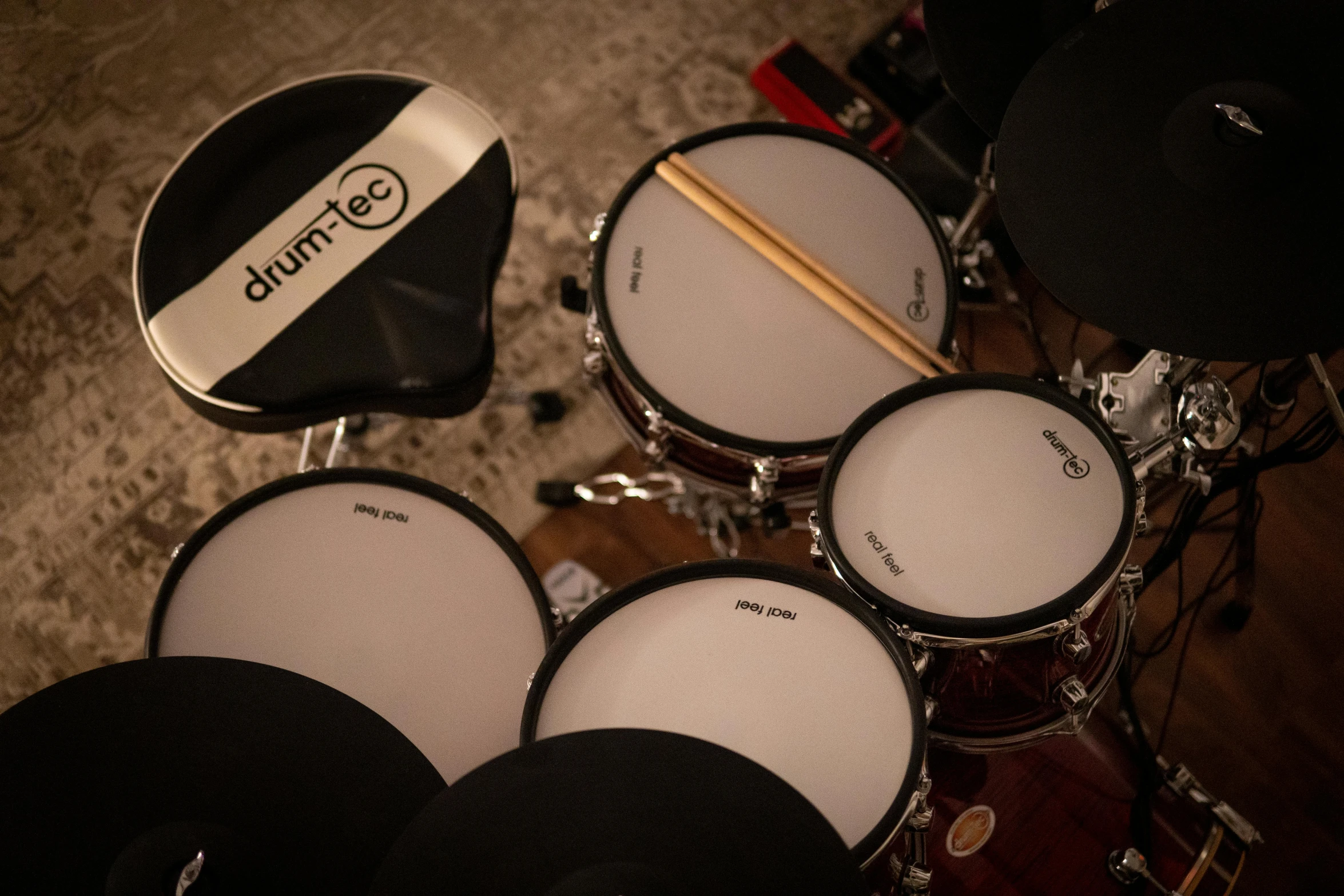 a drum kit sitting on top of a wooden floor, detailed product image, electric breeze, detail shots, portrait n - 9