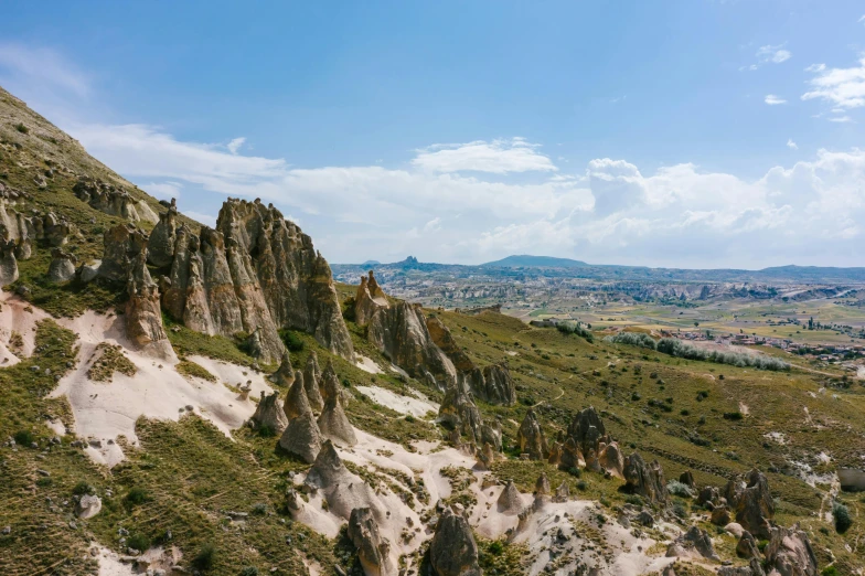 the landscape of cappadin in cappadin national park, cappadin national park, pexels contest winner, art nouveau, asymmetrical spires, 35 mm photo, looking down a cliff, sunny day time