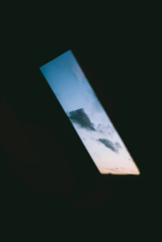 a picture of a sky seen through a window, an album cover, by Attila Meszlenyi, unsplash, postminimalism, photo taken on fujifilm superia, transparent black windshield, filtered evening light, sky - high view