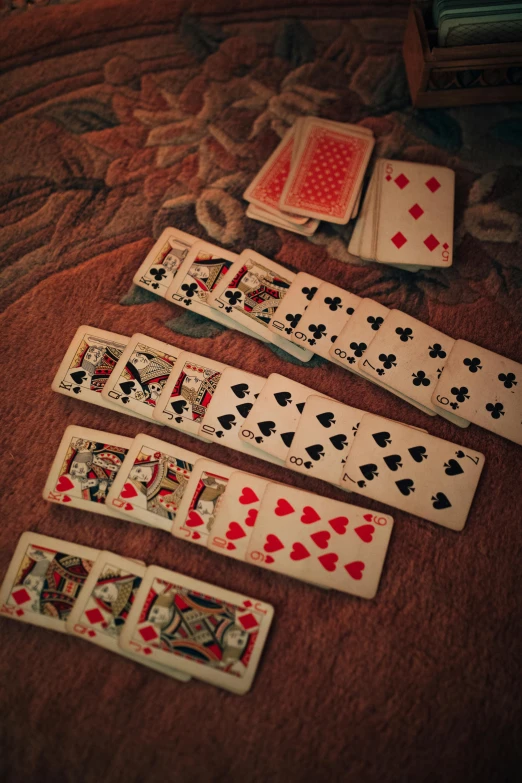 a number of playing cards on a table, a screenshot, unsplash, multiple stories, battered, square, 1 9 6 0's