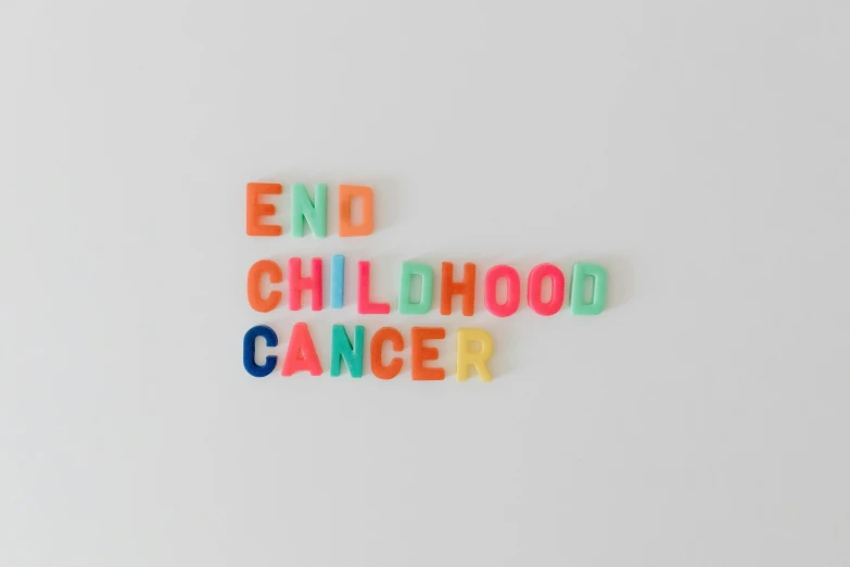 a sign that says end childhood cancer, by Emma Andijewska, trending on unsplash, candy colors, ☁🌪🌙👩🏾, celluloid, children's toy