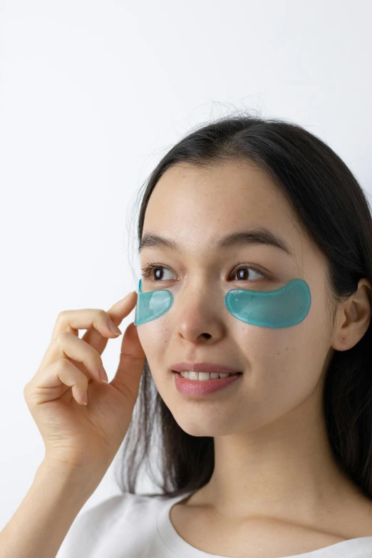 a woman with a blue eye patch on her face, lineart, by Tadashi Nakayama, hurufiyya, photoshoot for skincare brand, wearing goggles, rippling, silicone skin