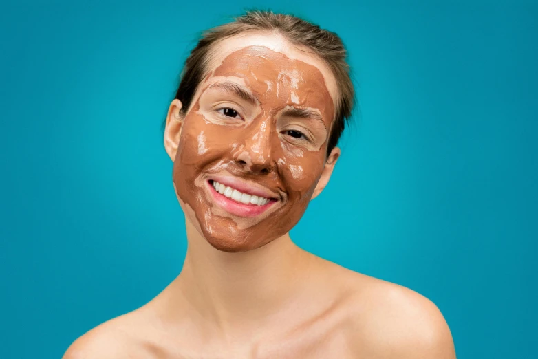 a woman with a facial mask on her face, by Julia Pishtar, shutterstock, antipodeans, fully chocolate, smiling expression, square facial structure, tanned