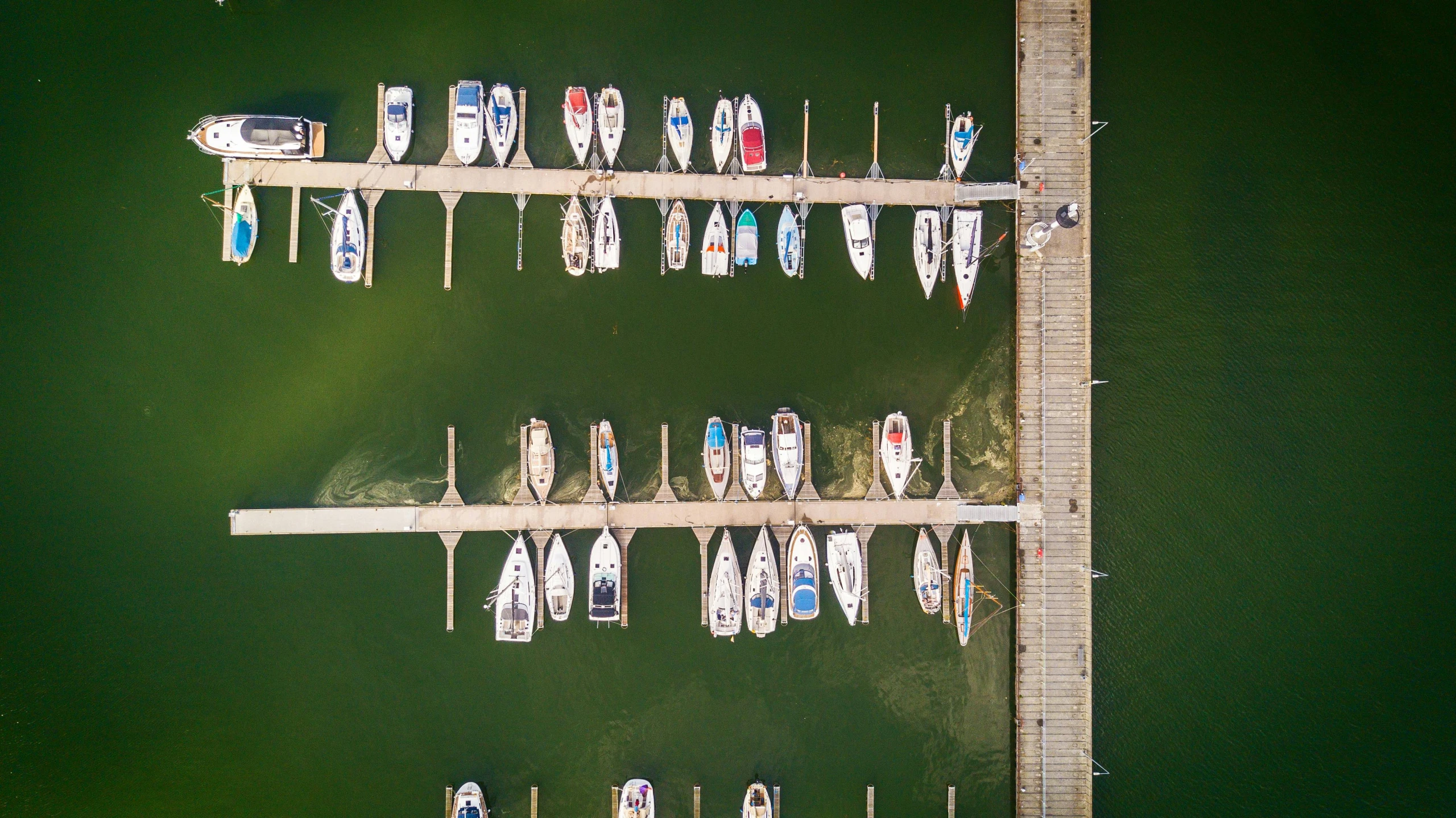 a number of boats in a body of water, pexels contest winner, top down photo at 45 degrees, boat dock, graphic print, a green