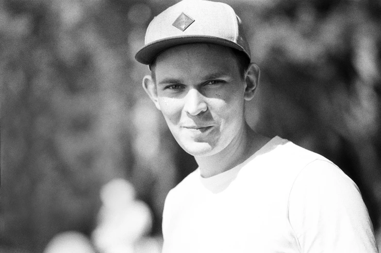 a black and white photo of a baseball player, bauhaus, vitalik buterin, 15081959 21121991 01012000 4k, wearing baseball cap, tourist photo