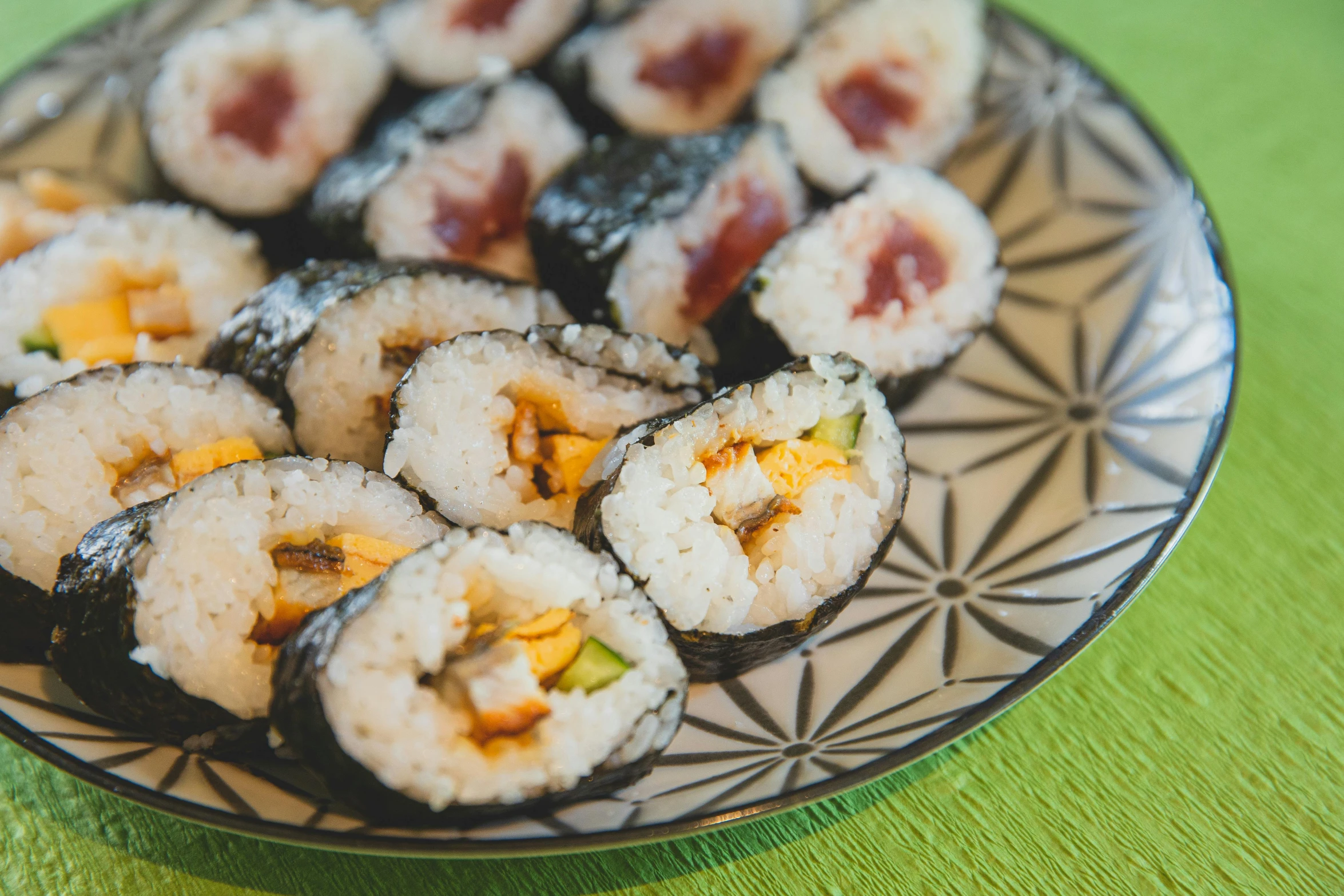 a plate of sushi sitting on a table, inspired by Maki Haku, unsplash, mingei, square, medium angle, thumbnail