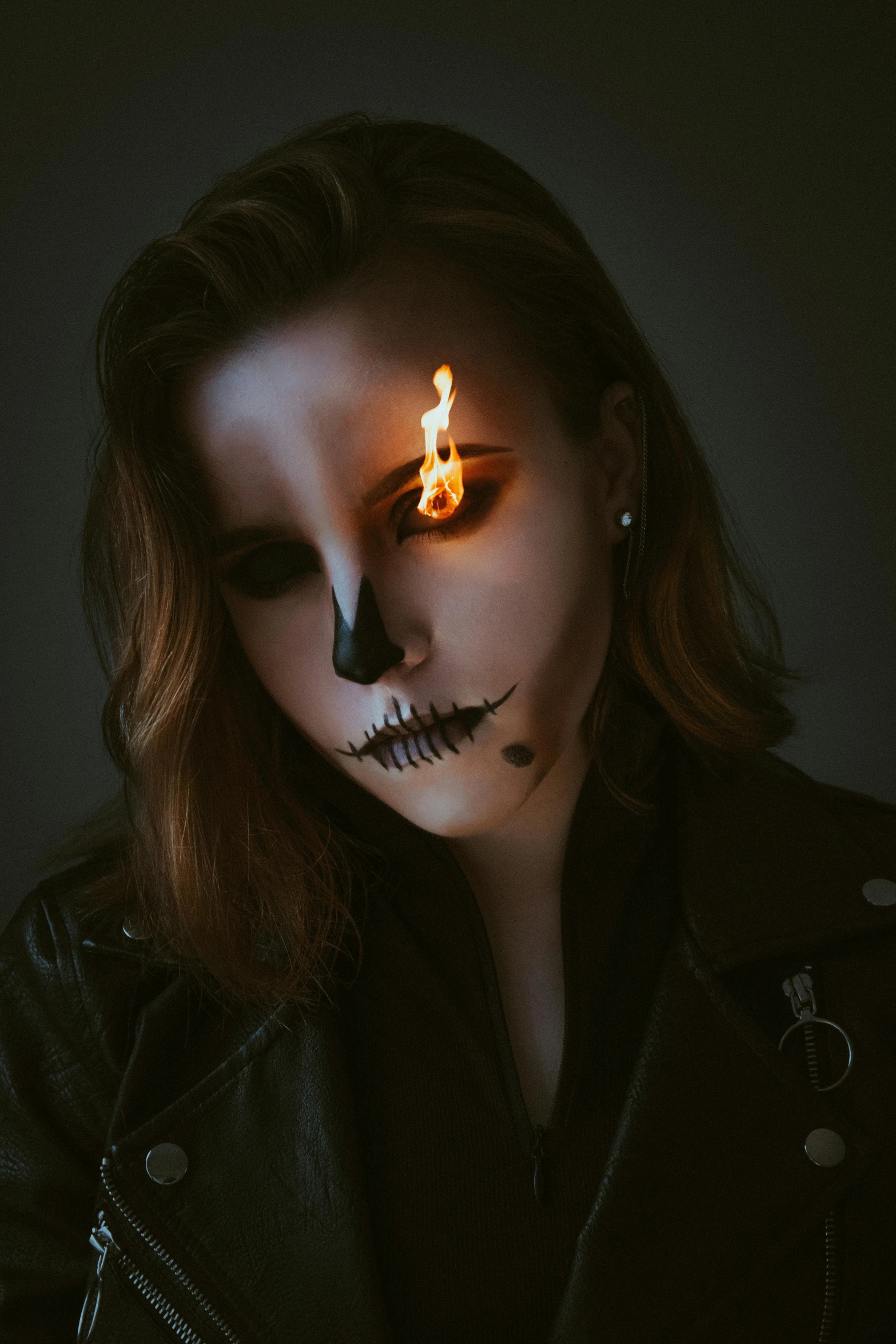 a woman with her face painted like a skeleton, an album cover, inspired by Elsa Bleda, pexels contest winner, casting a flame spell, halfbody headshot, moira from overwatch, ghost rider